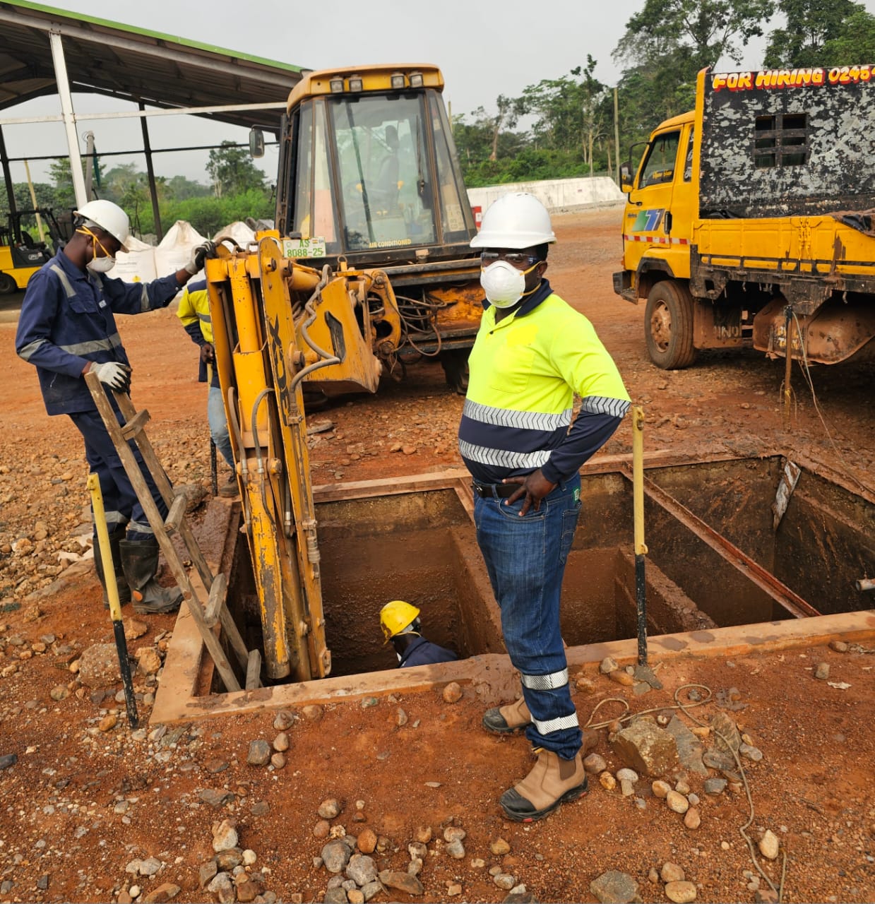 Construction site with workers and excavation